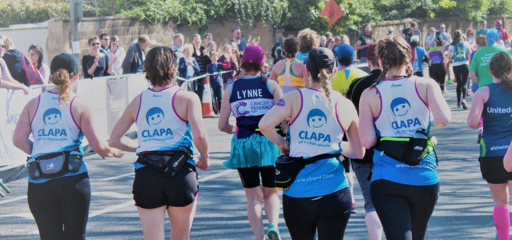 Four runners in CLAPA vests