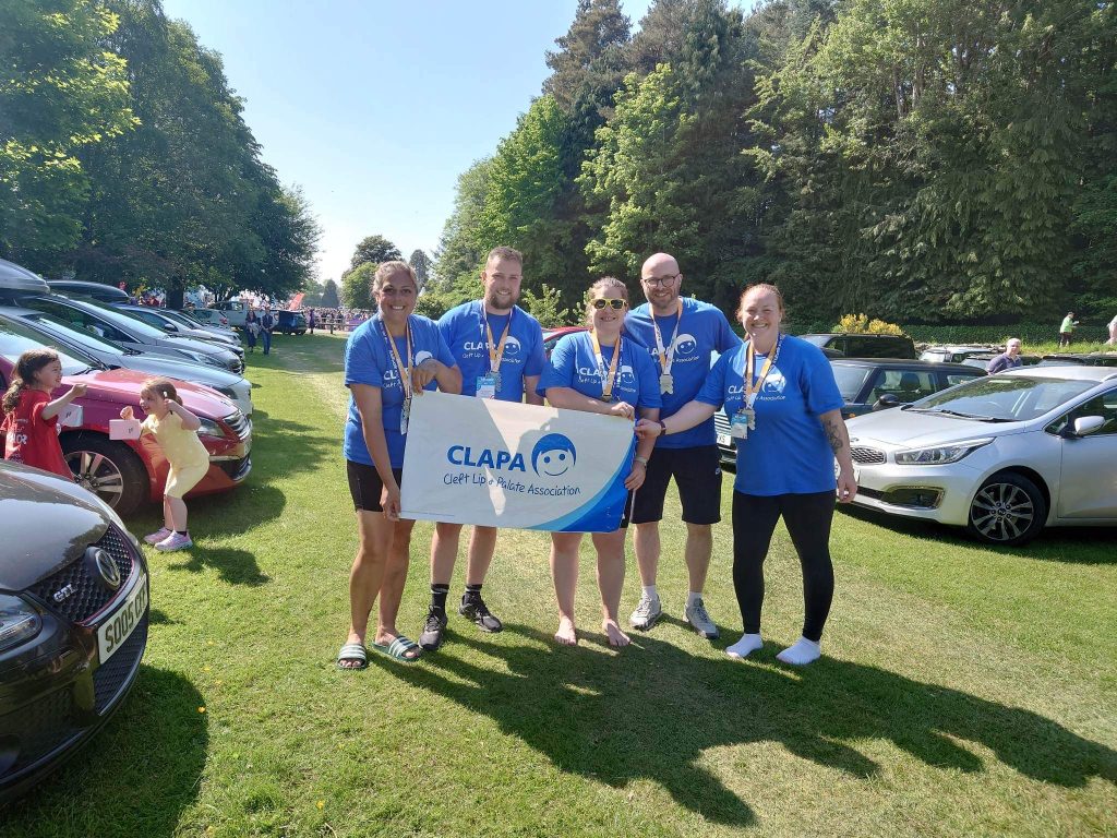 Group photo of the Kitlwalk with a CLAPA flag