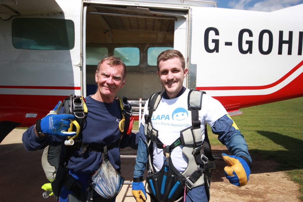 Two people waiting to sky dive